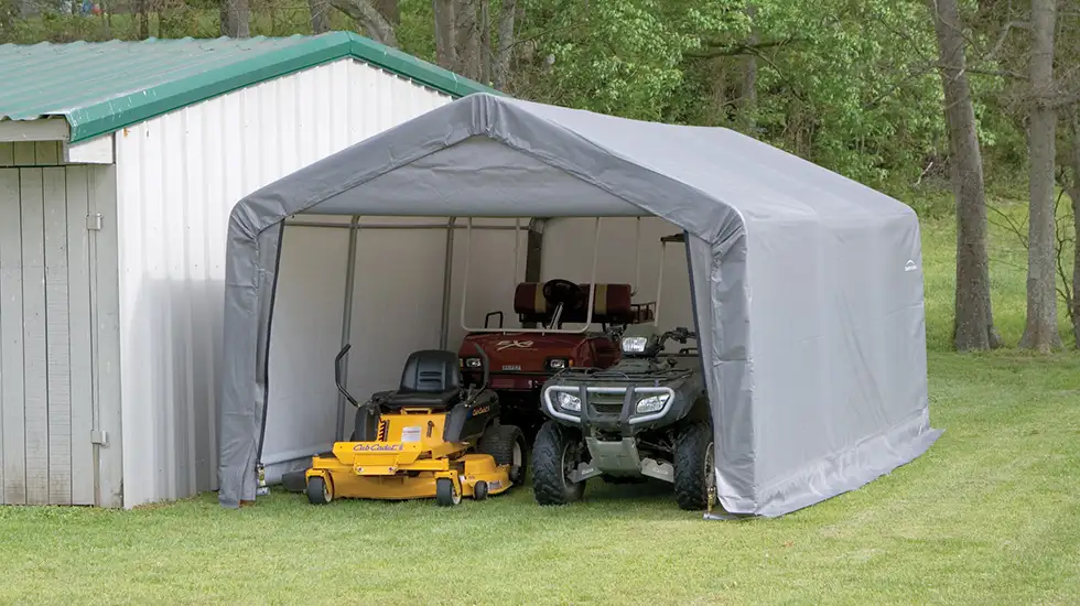 Shelter with Lawnmower and ATV