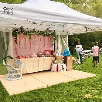 a pop-up canopy at an outdoor party